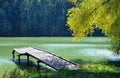 Small wooden pier near the river Royalty Free Stock Photo