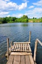 Small wooden pier near the river Royalty Free Stock Photo