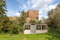 A small wooden shed in front of the ruin castle Teylingen