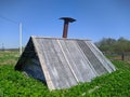 small wooden shed in the ground against the blue sky in the daytime Royalty Free Stock Photo