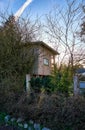 Small wooden tree house in a garden