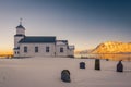 The small wooden white church in GimsÃÂ¸y on the beach on the Lofoten islands in Norway in winter with beautiful old cemetary and Royalty Free Stock Photo