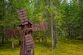 Small wooden windmill surrounded by pine forests Royalty Free Stock Photo