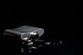 Spilled Metal Hip Flask in the Dark Royalty Free Stock Photo