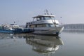 A small yacht docked on the Danube promenade Royalty Free Stock Photo