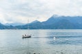 Small yacht docked in the marina of Varenna, one of the most picturesque towns on the shore of Lake Como. Varenna, Italy Royalty Free Stock Photo