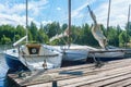 Small yachts moored at a wooden pier Royalty Free Stock Photo