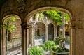 Small yard with fountain, birds and plants inside church