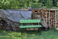 Small yard with woodstack and place for rest Royalty Free Stock Photo