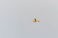 Small and yellow air plane on the sky Royalty Free Stock Photo