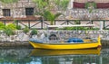 Small yellow boat moored in canal Royalty Free Stock Photo