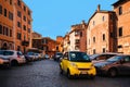 Yellow car in Trastevere, Rome, Italy