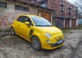 Small yellow Italian compact car Fiat 600 retro style Royalty Free Stock Photo