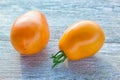 Small yellow pear heirloom tomato on wooden table Royalty Free Stock Photo