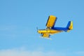 A yellow plane with a propeller on the blue sky Royalty Free Stock Photo