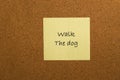 Small yellow sticky note on office noticeboard