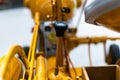 Small yellow tractor in exhibition, closeup details, wheels Royalty Free Stock Photo