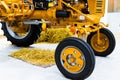 Small yellow tractor in exhibition, closeup details, wheels Royalty Free Stock Photo