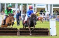 Small young children racing on shetland ponies