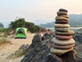 Small zen stone tower with camping Royalty Free Stock Photo