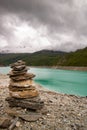 small zen stone tower in front of the clear lake Royalty Free Stock Photo