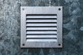 Small zinc metal plated ventilation grille on the wall