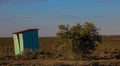 Small zinc outbuilding in a vast landscape Royalty Free Stock Photo