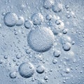 Smaller bubbles are smooth and reflective, scattered throughou Royalty Free Stock Photo