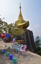 A smaller golden rock on the way to the top of Kyaiktiyo Pagoda at Mon State, Burma