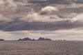 Smaller islands of Wollaston archipelago under cloudscape, Cape Horn, Chile Royalty Free Stock Photo