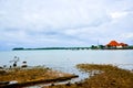 Smalll simple traditional building on the quiet pier harbor in the fresh morning sunrise air Royalty Free Stock Photo