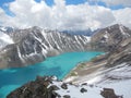 Smaragd water of misty Ala Kul lake