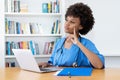 Smart afro american nurse or medical student at computer Royalty Free Stock Photo