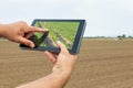 Smart agriculture. Farmer using tablet Soy planting. Modern Agriculture concept. Royalty Free Stock Photo