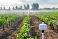 Smart agriculture technology in action on a vibrant irrigated farm field Royalty Free Stock Photo