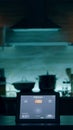 Smart application on tablet placed on kitchen desk in empty house Royalty Free Stock Photo