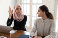 Arabic female employee participate in briefing in office