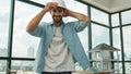 Smart architect engineer wear safety helmet while sitting on table. Tracery Royalty Free Stock Photo