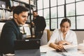 Smart Asian working women discuss project with male team work in modern office Royalty Free Stock Photo