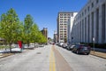 the Smart Bank building, The Dome building and The Volunteer State Life Building, cars driving on the street and a clear blue sky