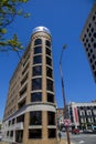 the Smart Bank building with lush green trees and red brick office buildings and a gorgeous clear blue sky in Chattanooga