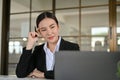 Smart and beautiful young Asian businesswoman thinking an ideas, working in the office Royalty Free Stock Photo