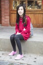 Smart beauty girl sitting on the stairs. Royalty Free Stock Photo