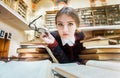 Girl with Books in the Library Royalty Free Stock Photo