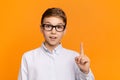 Smart boy pointing finger up, having idea or found solution Royalty Free Stock Photo