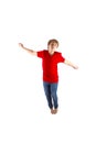 Smart boy with red shirt jumping Royalty Free Stock Photo