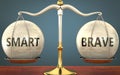 Smart and brave staying in balance - pictured as a metal scale with weights and labels smart and brave to symbolize balance and