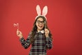Smart bunny. Eyewear booth props. Little cute bunny. Having fun. Schoolgirl bunny ears. Girl in Easter bunny at egg hunt