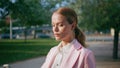 Smart business lady answering call standing sunny street close up. Woman talking