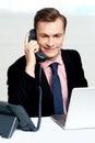 Smart businessman communicating on phone